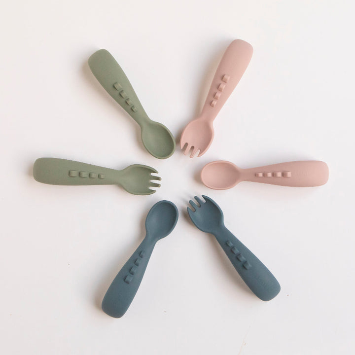silicone utensils range in three colours: olive, dusty pink, and blue slate on a white background